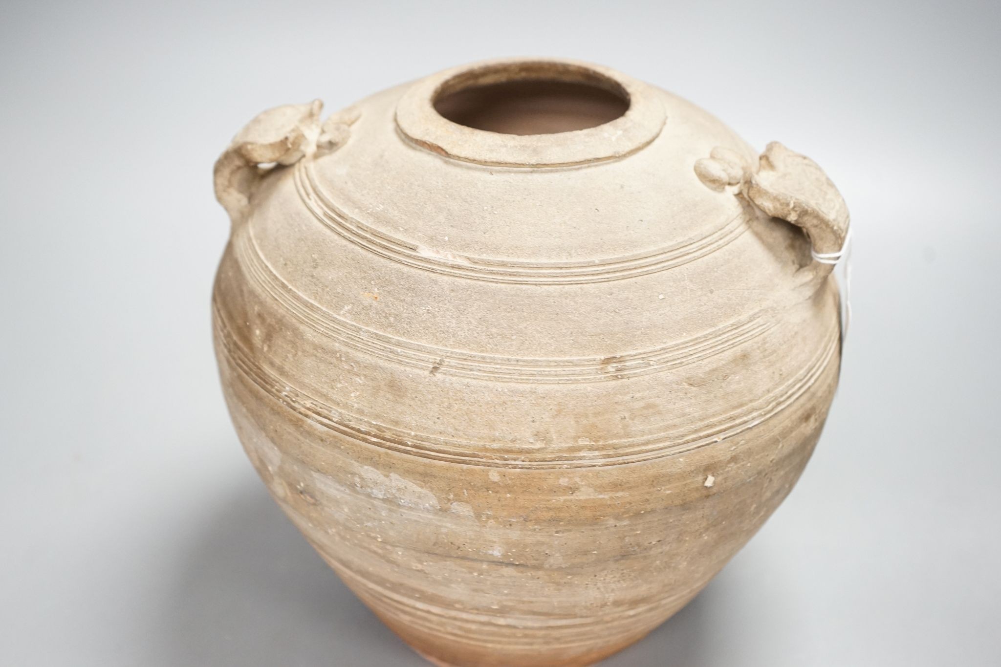 A Chinese Warring States pottery jar, 24cm